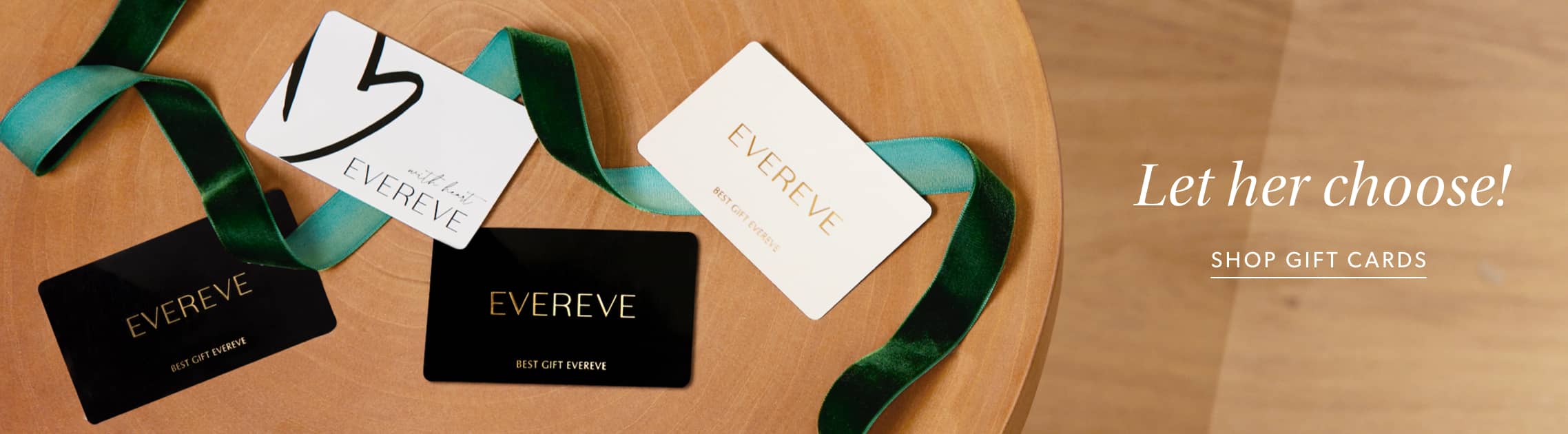 Image of an assortment of EVEREVE gift cards with a velvet ribbon and the caption "Let her choose!"