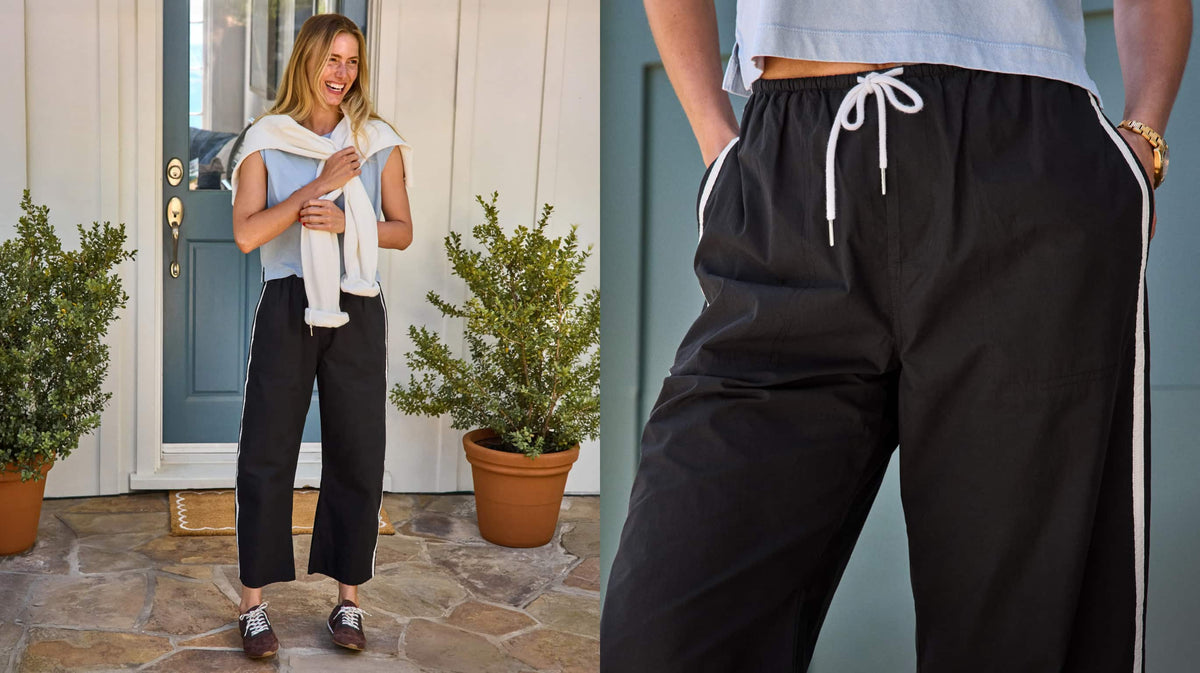 Image of woman wearing blue tank and black track pants.