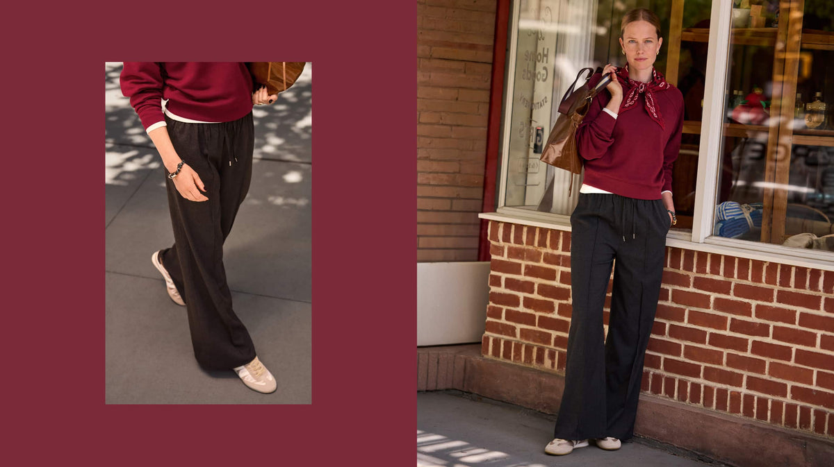 Woman wearing maroon pullover sweatshirt with bandana scarf and grey pull on track pants with sneakers.