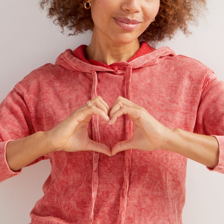 Image of woman making a heart with her hands