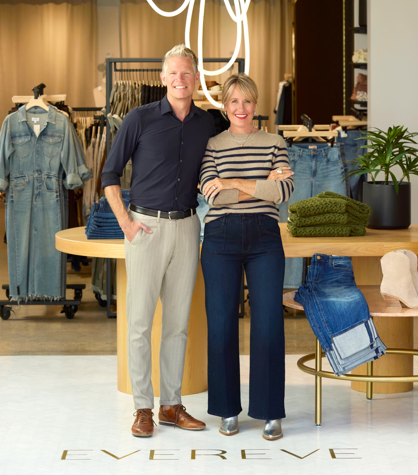 Image of Megan and Mike Tamte in front of an EVEREVE store. 
