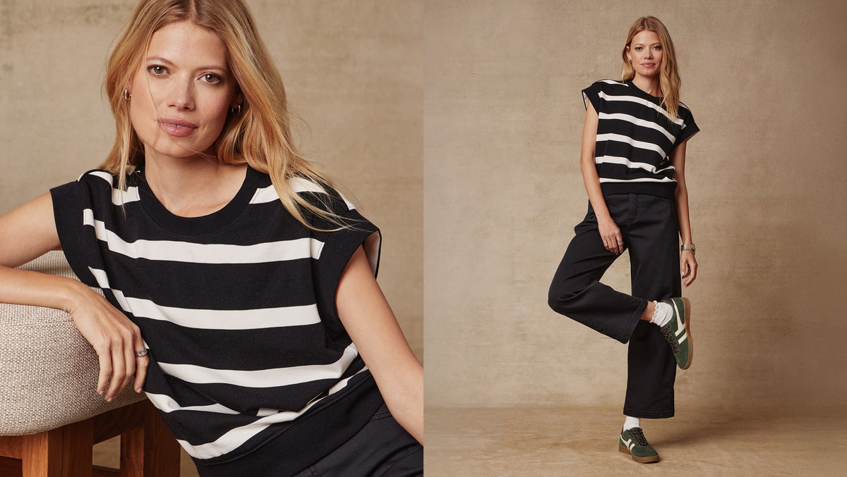 Image of woman wearing striped Sutton sweatshirt and Marni pants