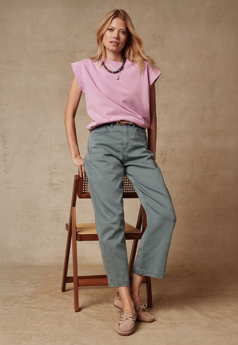 Image of woman wearing pink Sutton sweatshirt and Marni pants