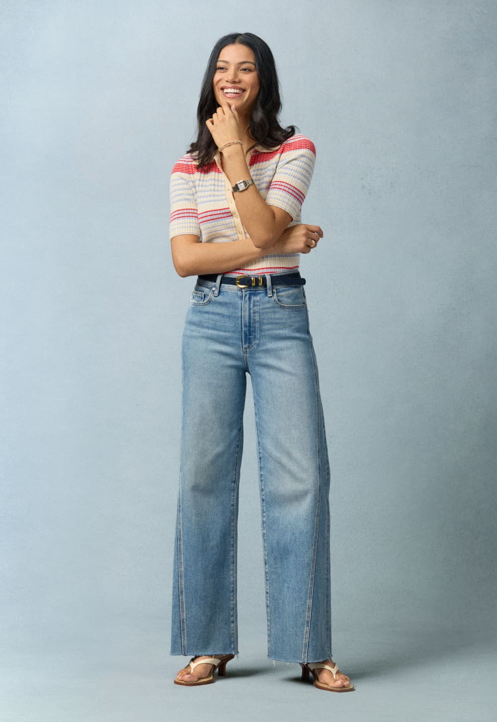 Image of woman wearing EVEREVE wide leg jeans and a striped tee.
