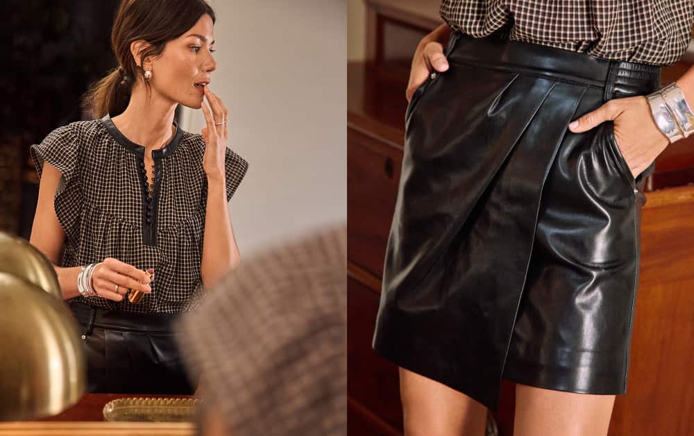 Woman wearing a split neck blouse with faux leather strap skirt