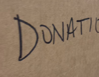Video of EVEREVE employees packing up clothing donations. 
