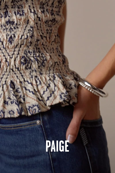 Video of woman wearing Paige brand jeans.